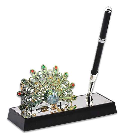 a beautiful pen stand with an elaborate figure of a peacock attached to its base along with a pen