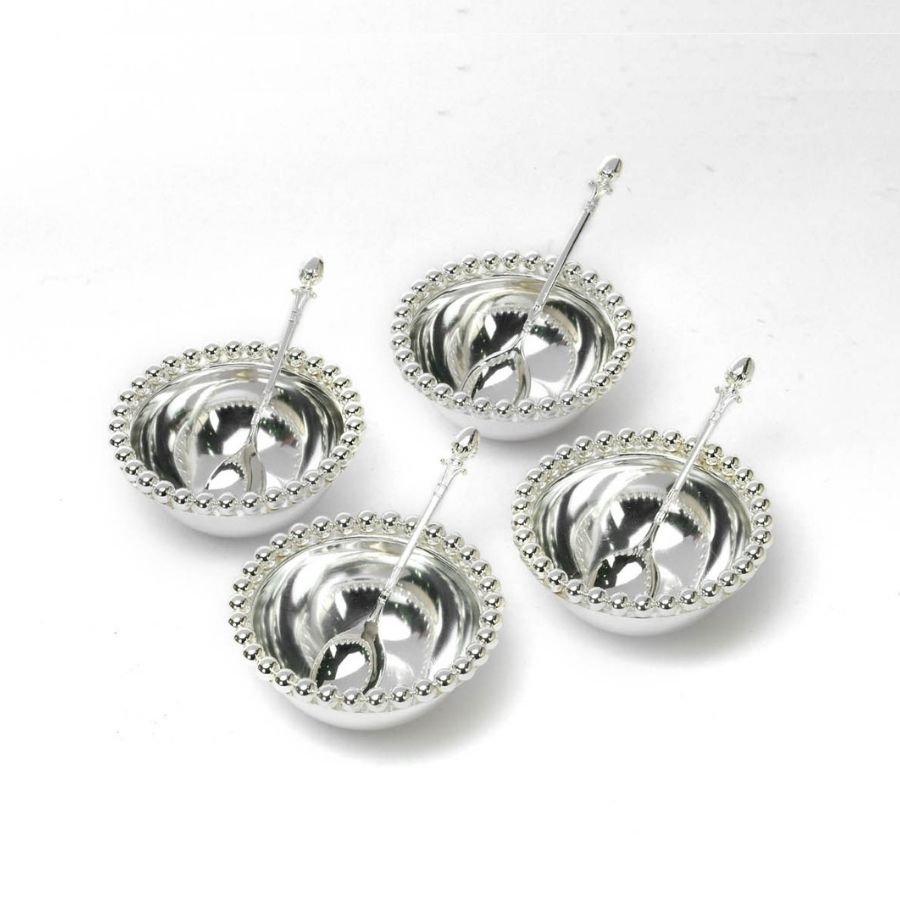 a set of 4 silver bowls having beaded rims with spoons