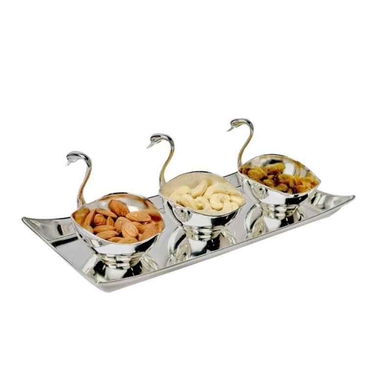 a set of 3 duck shaped silver bowls kept next to each other on a silver tray