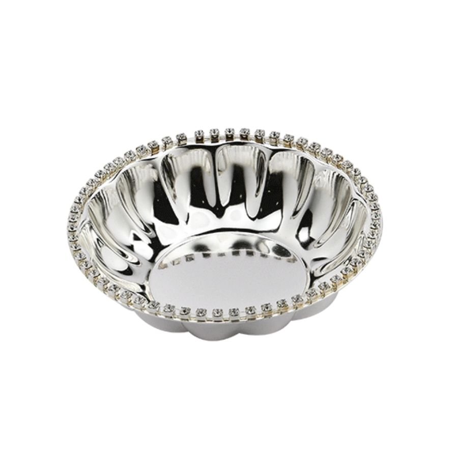 a round silver bowl with crystal studded rim and a fluted interior