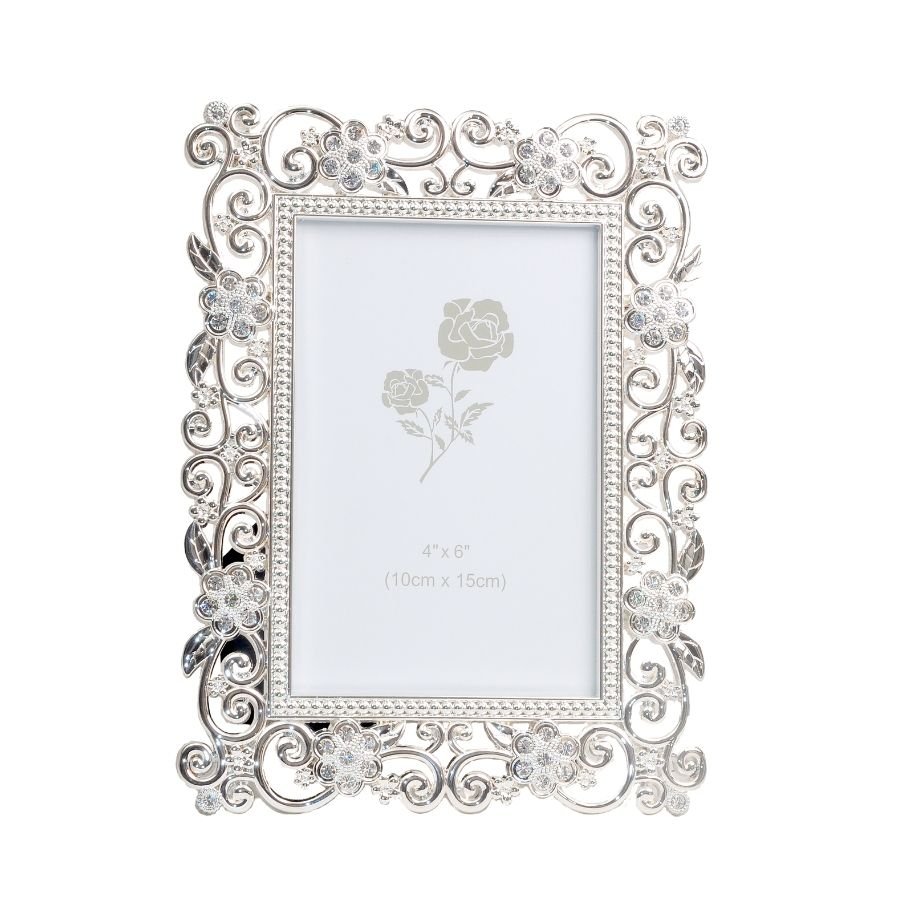 A luminously beautiful photo frame with delicate patterns on its borders made of silver