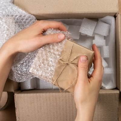 a picture of two hands holding a gift