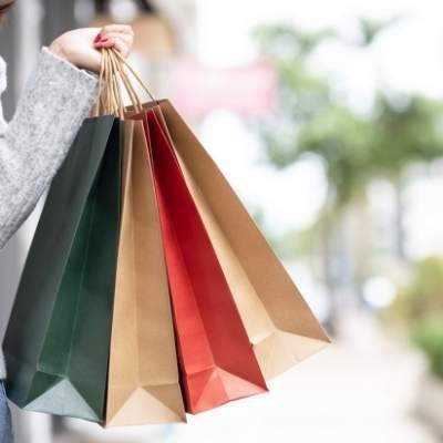 a picture with multiple shopping bags in hand