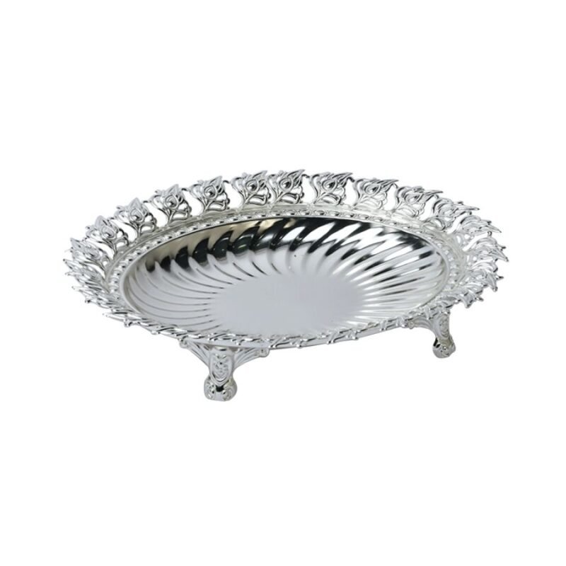 a beautiful, round shaped silver bowl with peacock leaf motif along the border and a fluted facade